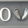12- love box cast, grey box, white letters, silver casts