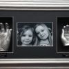 5- x2 silver hand casts in silver wood frame with black backing & mount